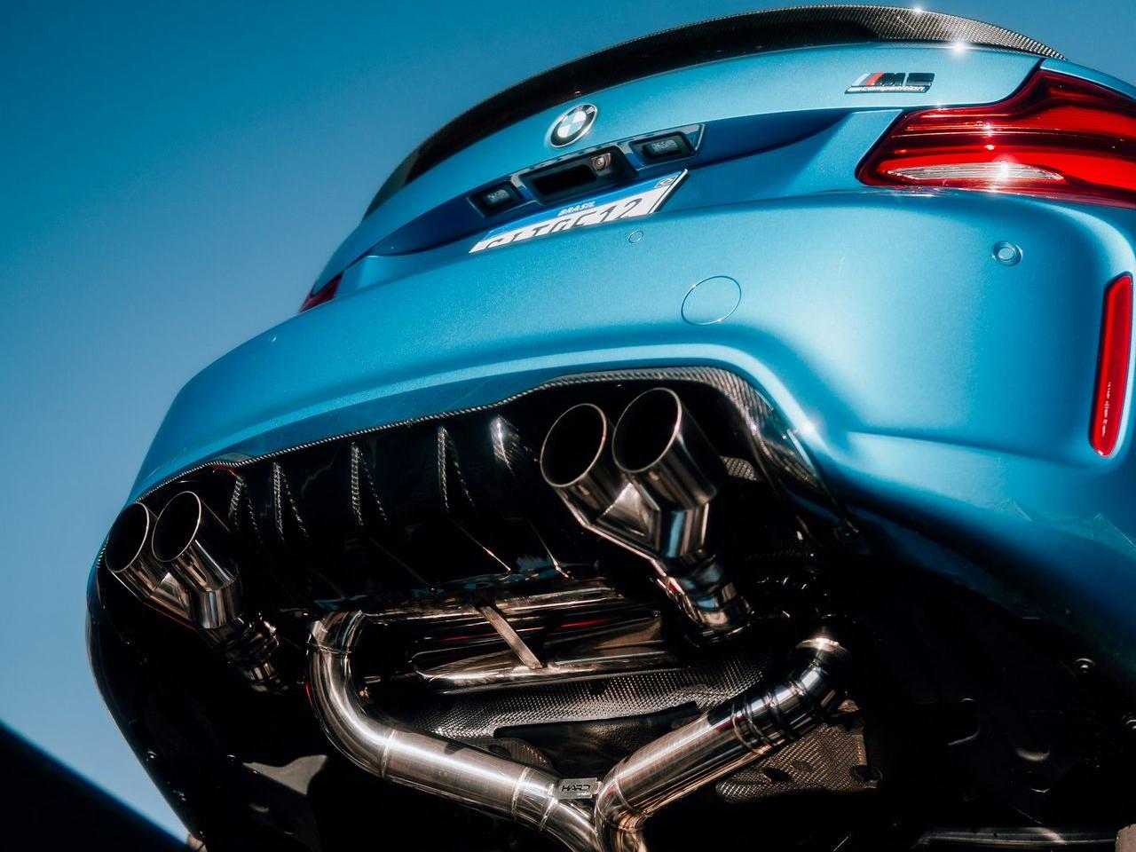 the back end of a blue sports car